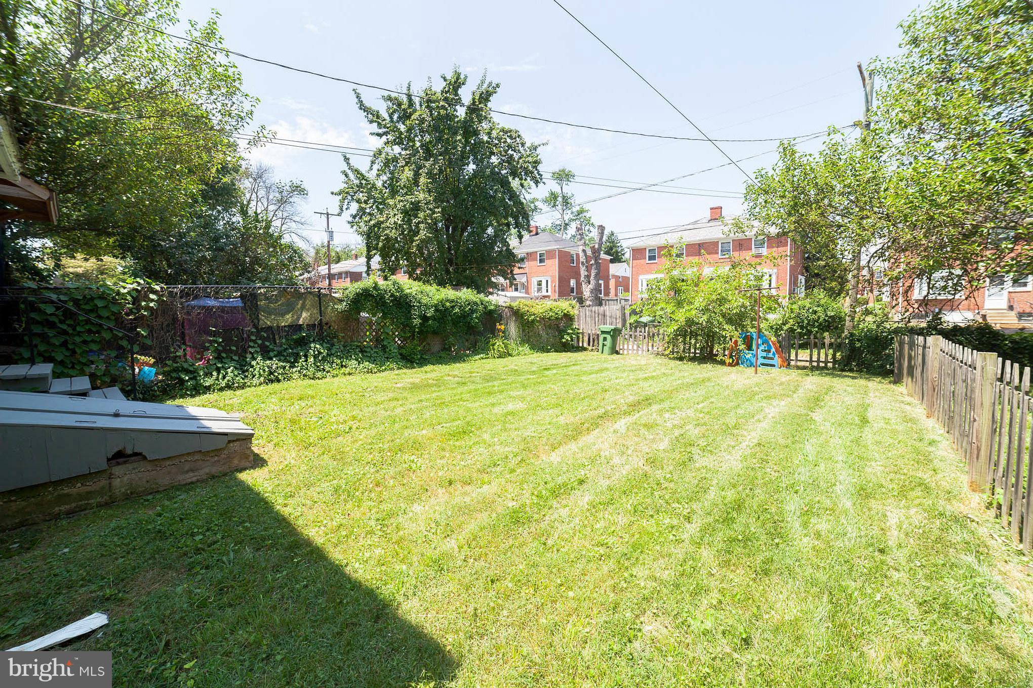 3908 Clarinth Road Baltimore, MD 21215 - Photo 23 of 23 a view of a garden with a building