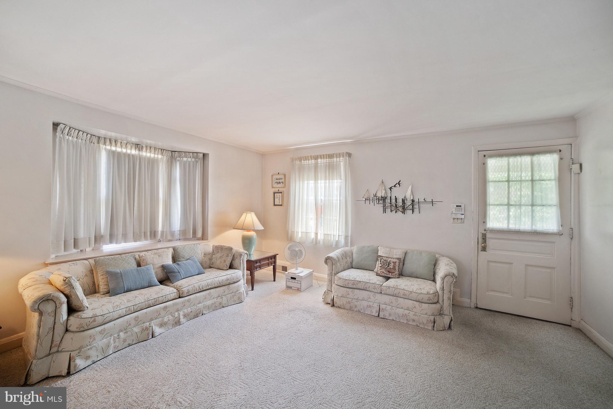 3908 Clarinth Road Baltimore, MD 21215 - Photo 5 of 23 a living room with furniture and a window
