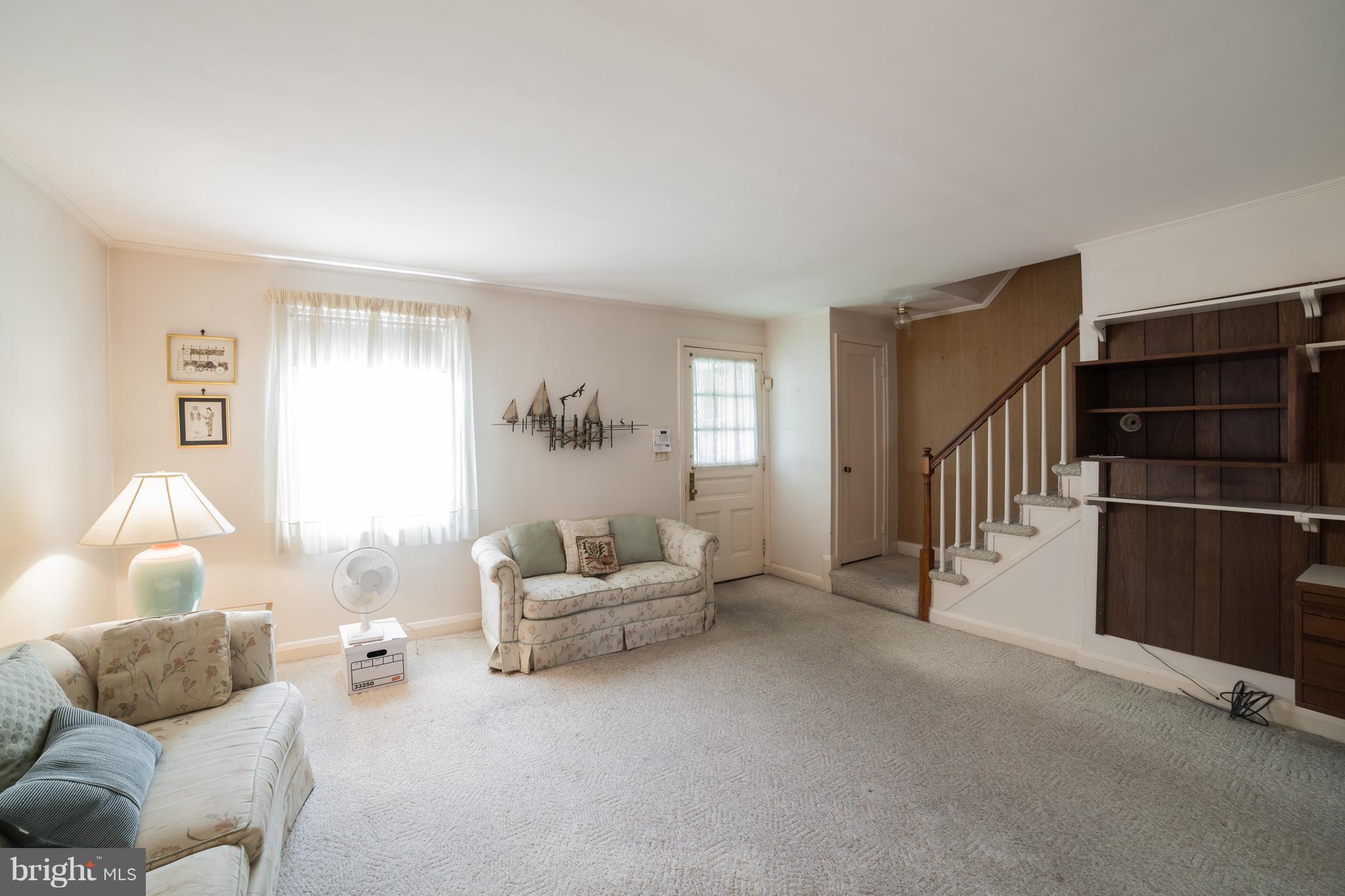 3908 Clarinth Road Baltimore, MD 21215 - Photo 6 of 23 a living room with furniture and a window