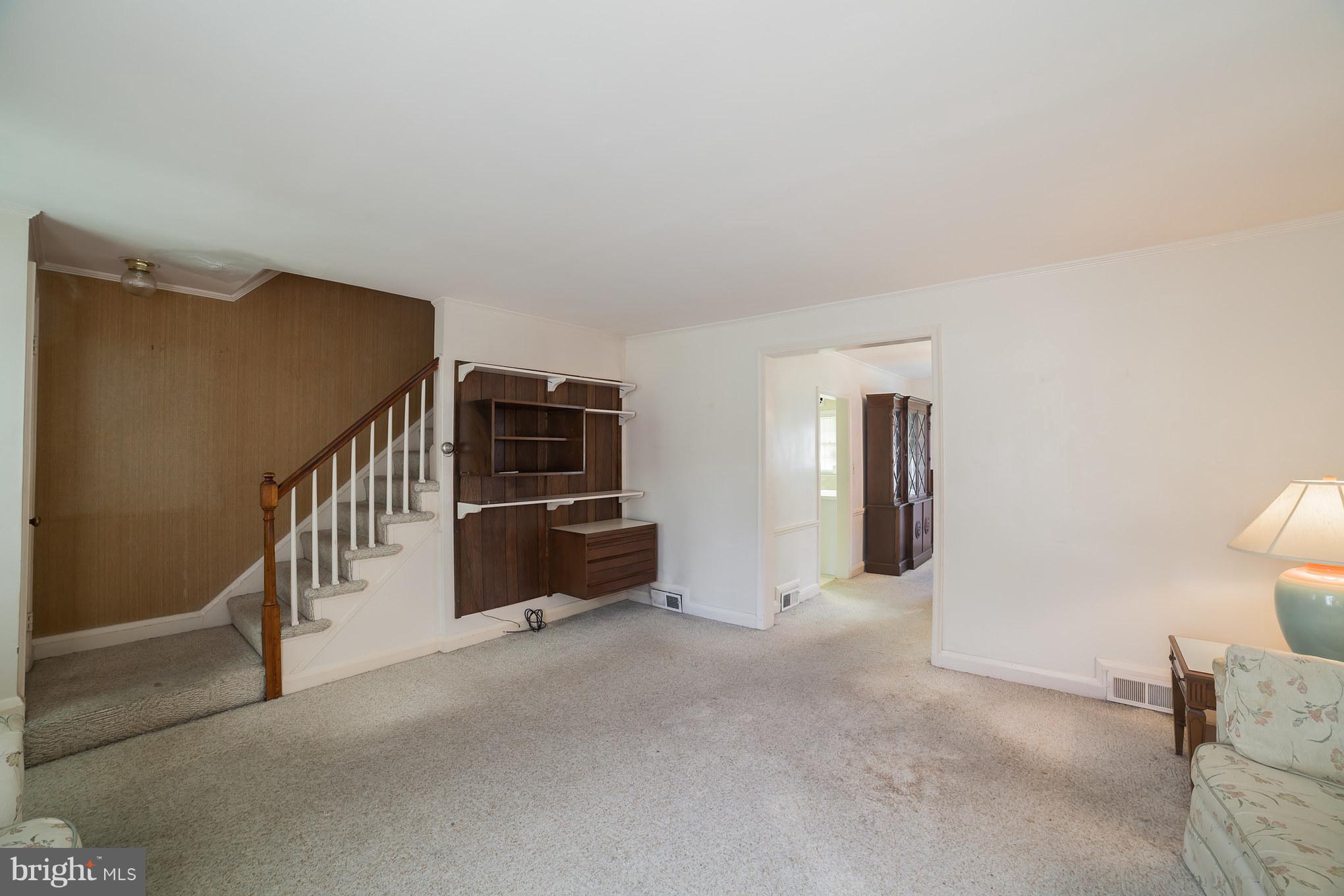 3908 Clarinth Road Baltimore, MD 21215 - Photo 7 of 23 a view of a livingroom with a staircase