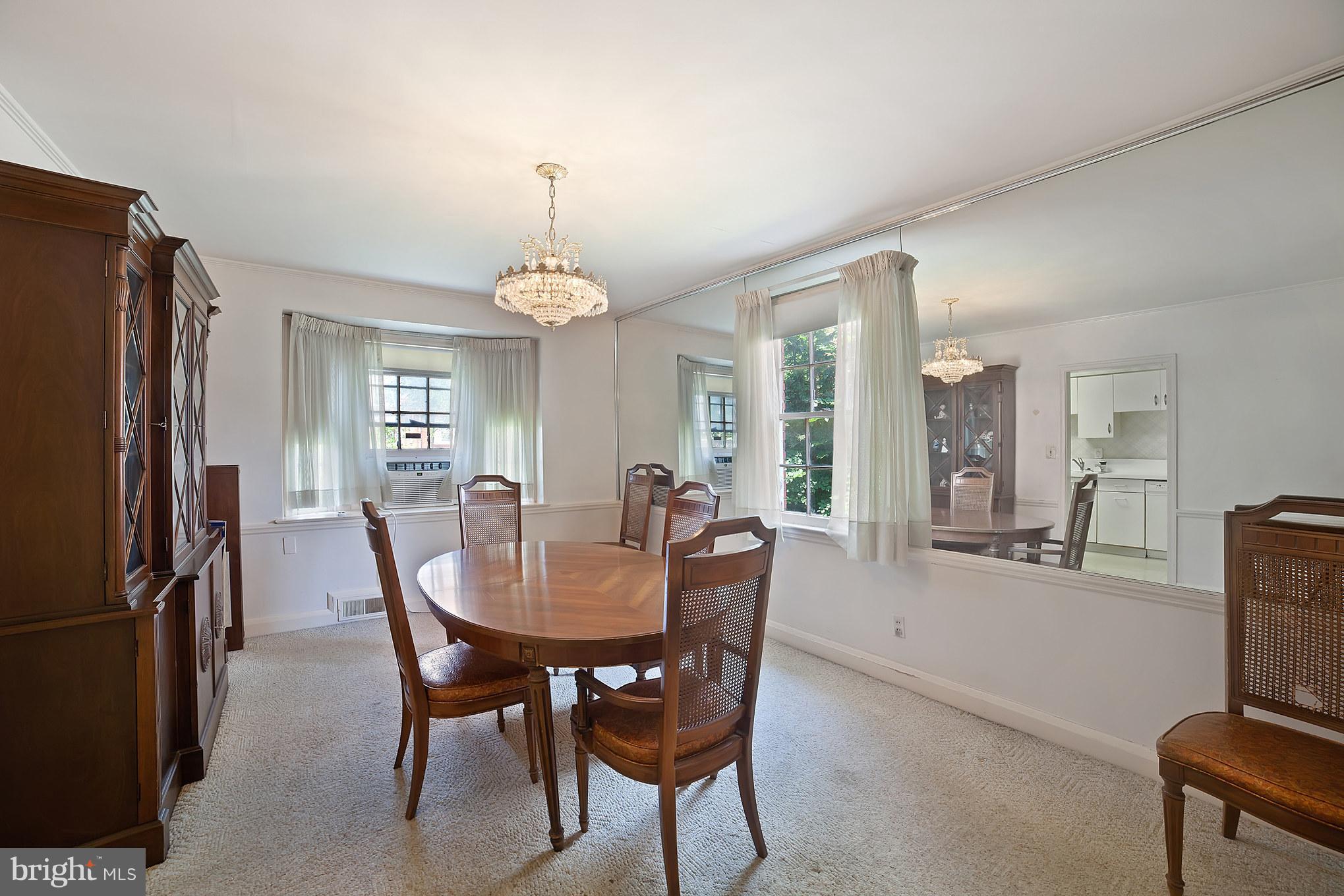 3908 Clarinth Road Baltimore, MD 21215 - Photo 8 of 23 a view of a dining room with furniture window and outside view