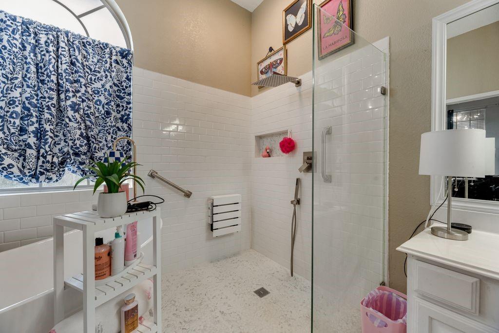 3205 Cape Cod Court Arlington, TX 76017 - Photo 22 of 30 a bathroom with a shower curtain and a sink