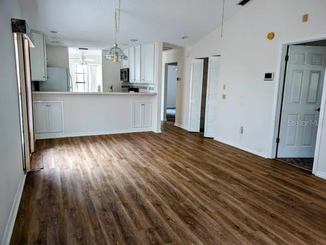 a view of a kitchen from the hallway