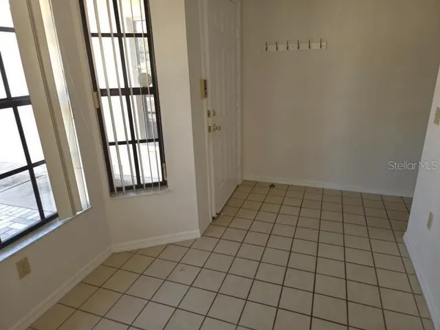 a view of an empty room and window