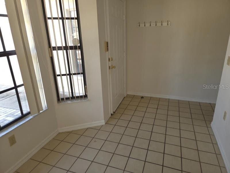 13229 Molitor Court Hudson, FL 34669 - Photo 5 of 12 a view of an empty room and window
