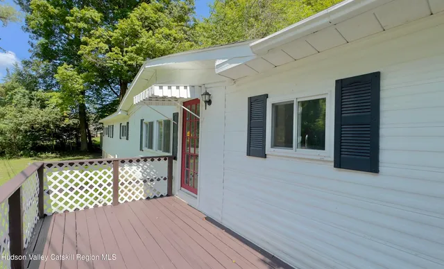 a front view of a house with deck