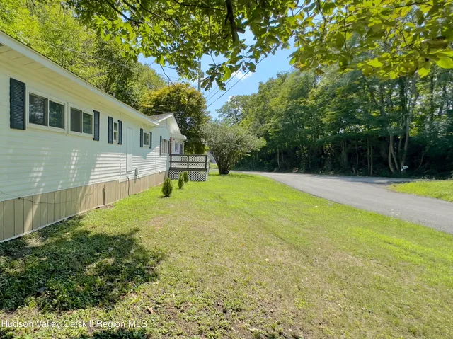a house with swimming pool in front of it