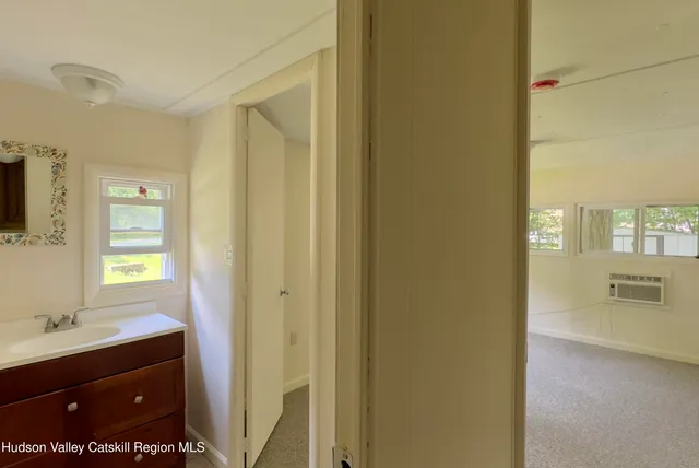 a bathroom with a sink a mirror and a shower