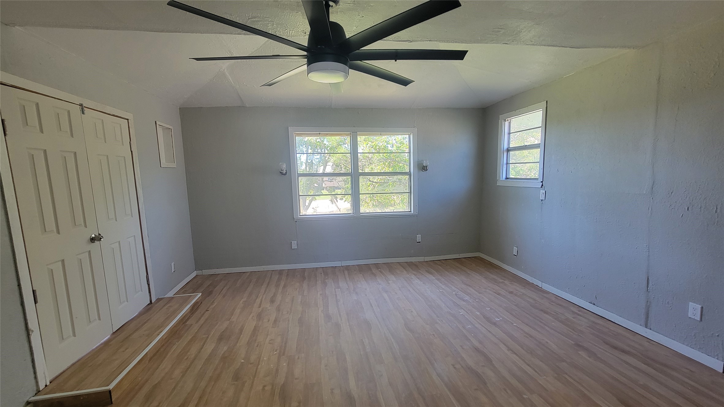 12018 Sandpiper Road Angleton, TX 77515 - Photo 18 of 48 wooden floor in an empty room with a window