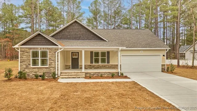 front view of a house with a yard