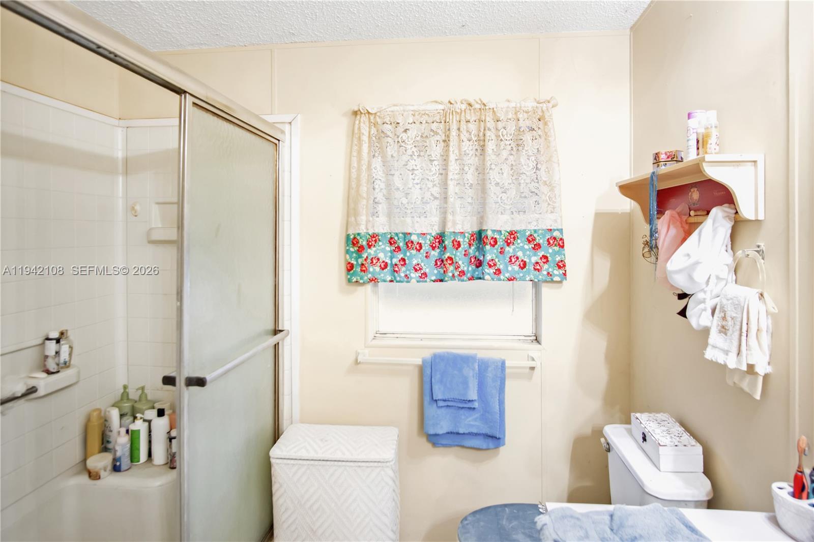 35250 Southwest 177th Court, Unit 48 Homestead, FL 33034 - Photo 17 of 29 a bathroom with a sink toilet and shower