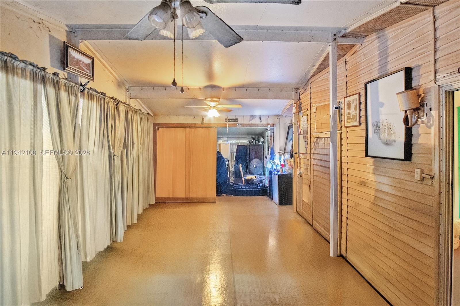 35250 Southwest 177th Court, Unit 48 Homestead, FL 33034 - Photo 20 of 29 a view of a hallway with a yellow slide