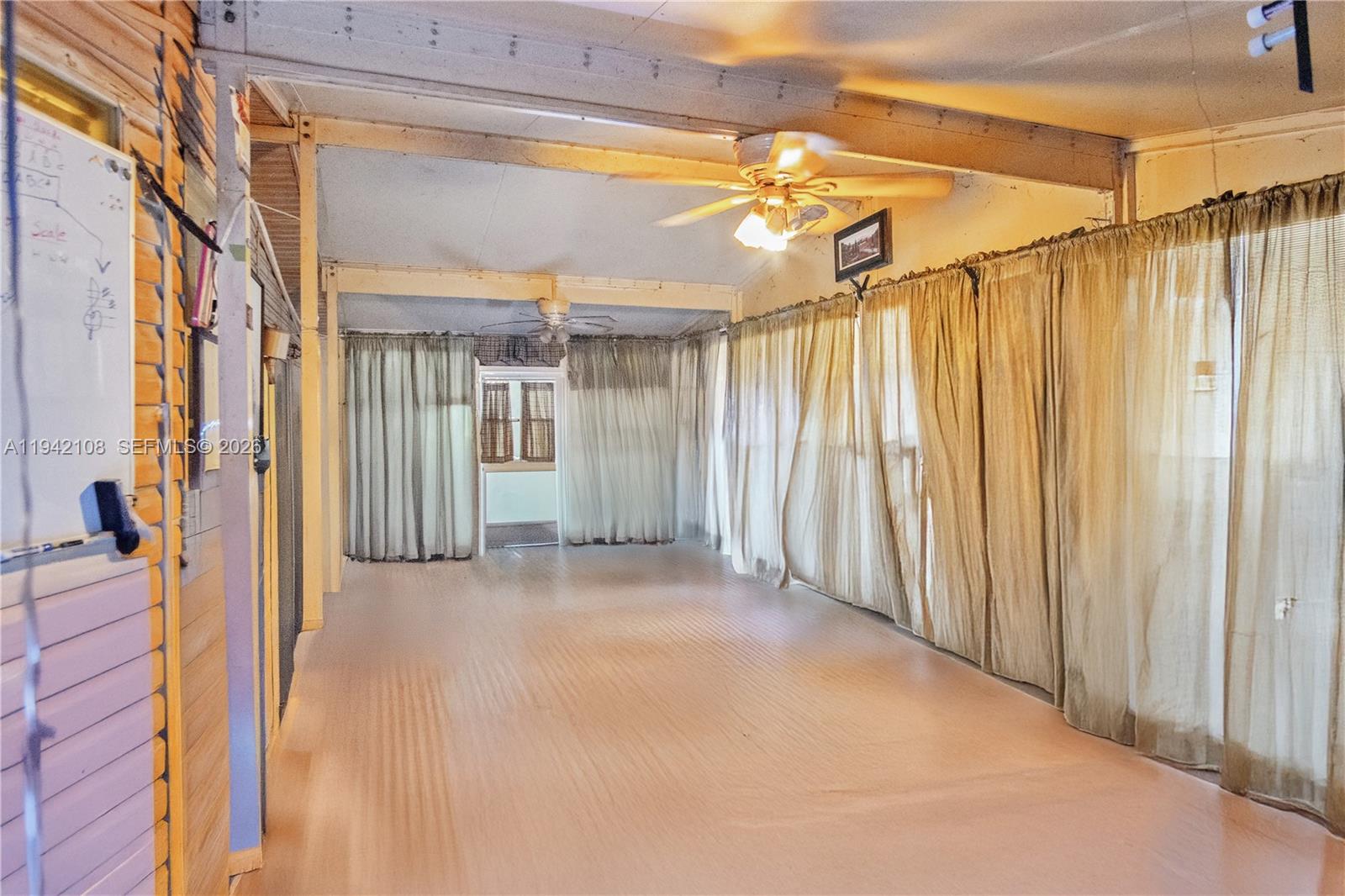35250 Southwest 177th Court, Unit 48 Homestead, FL 33034 - Photo 21 of 29 a view of a city street with a glass door