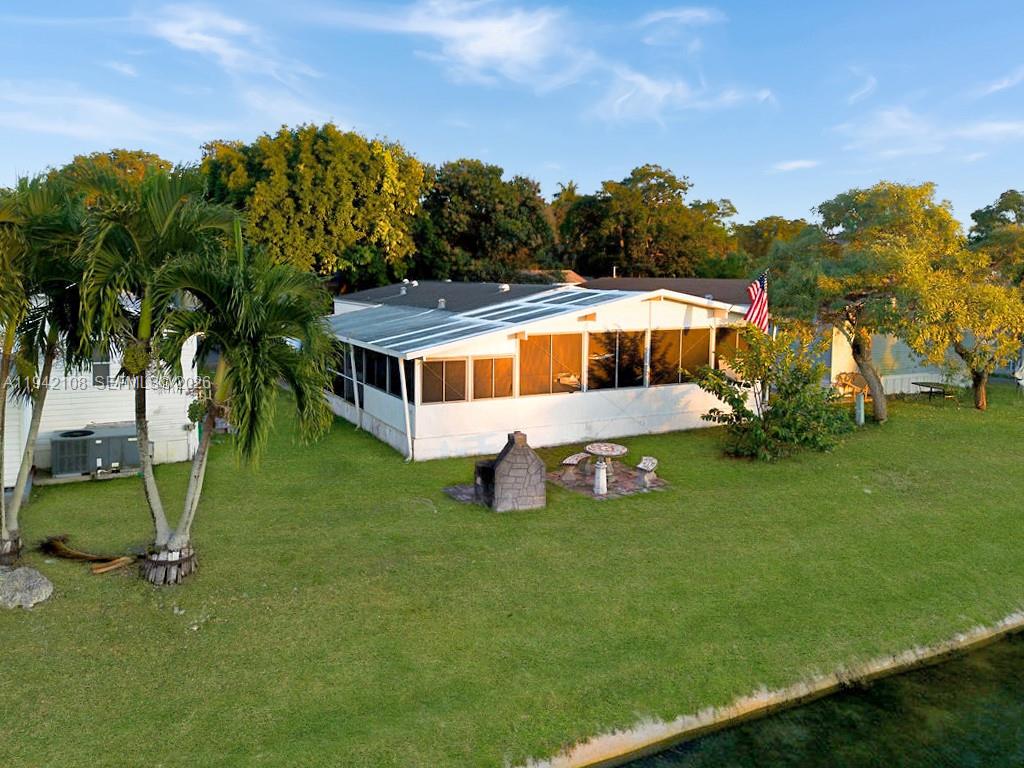 35250 Southwest 177th Court, Unit 48 Homestead, FL 33034 - Photo 25 of 29 a view of a house with a backyard