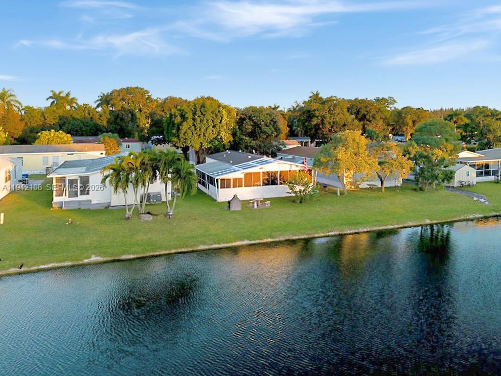 35250 Southwest 177th Court, Unit 48 Homestead, FL 33034 - Photo 3 of 29 an aerial view of a house with a yard basket ball court and outdoor seating