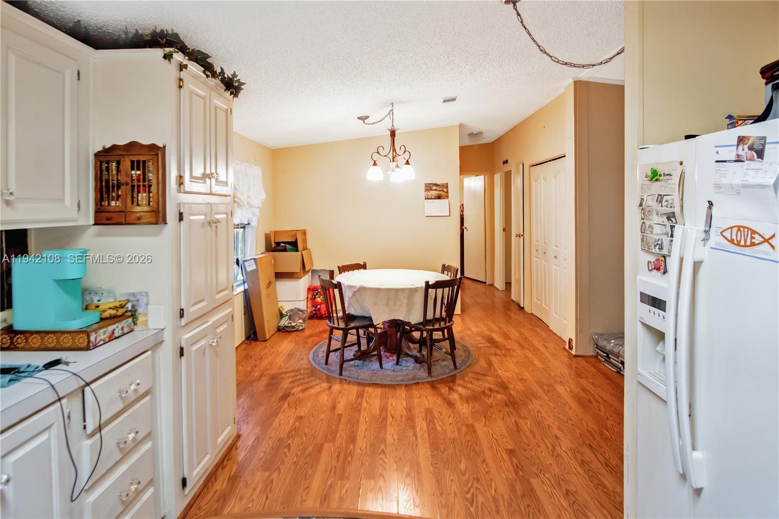 35250 Southwest 177th Court, Unit 48 Homestead, FL 33034 - Photo 8 of 29 a dining room with furniture and wooden floor