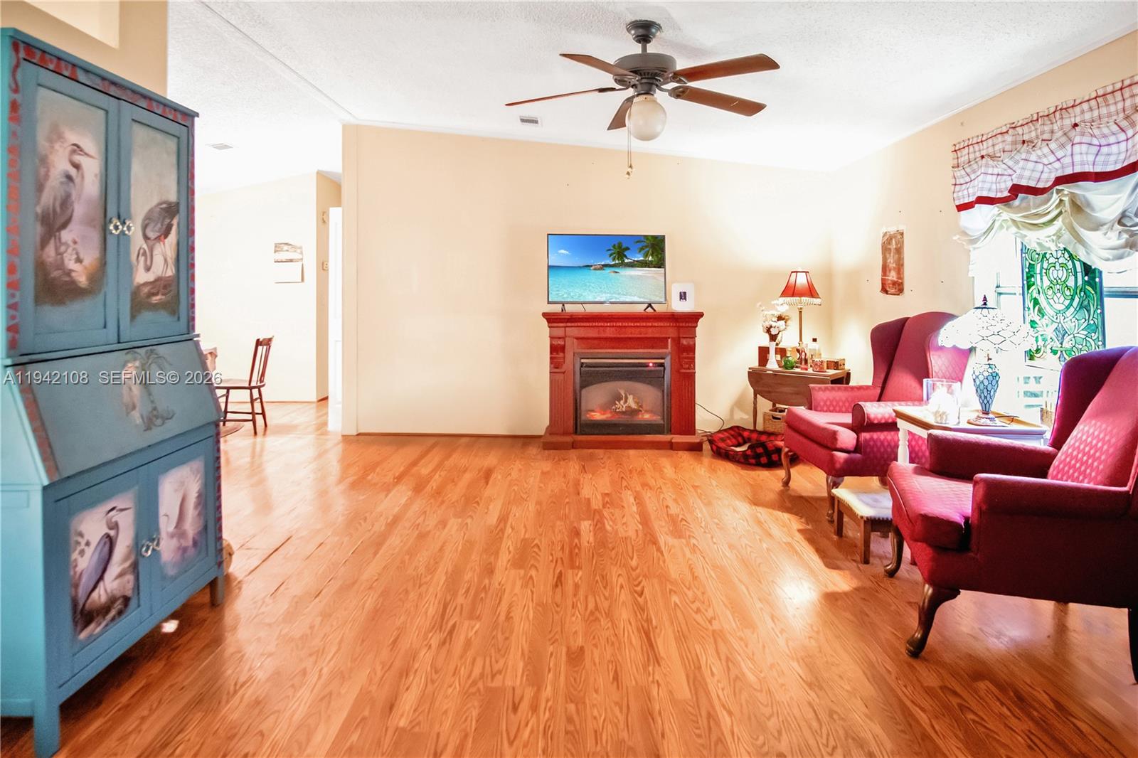 35250 Southwest 177th Court, Unit 48 Homestead, FL 33034 - Photo 10 of 29 a living room with furniture and a fireplace