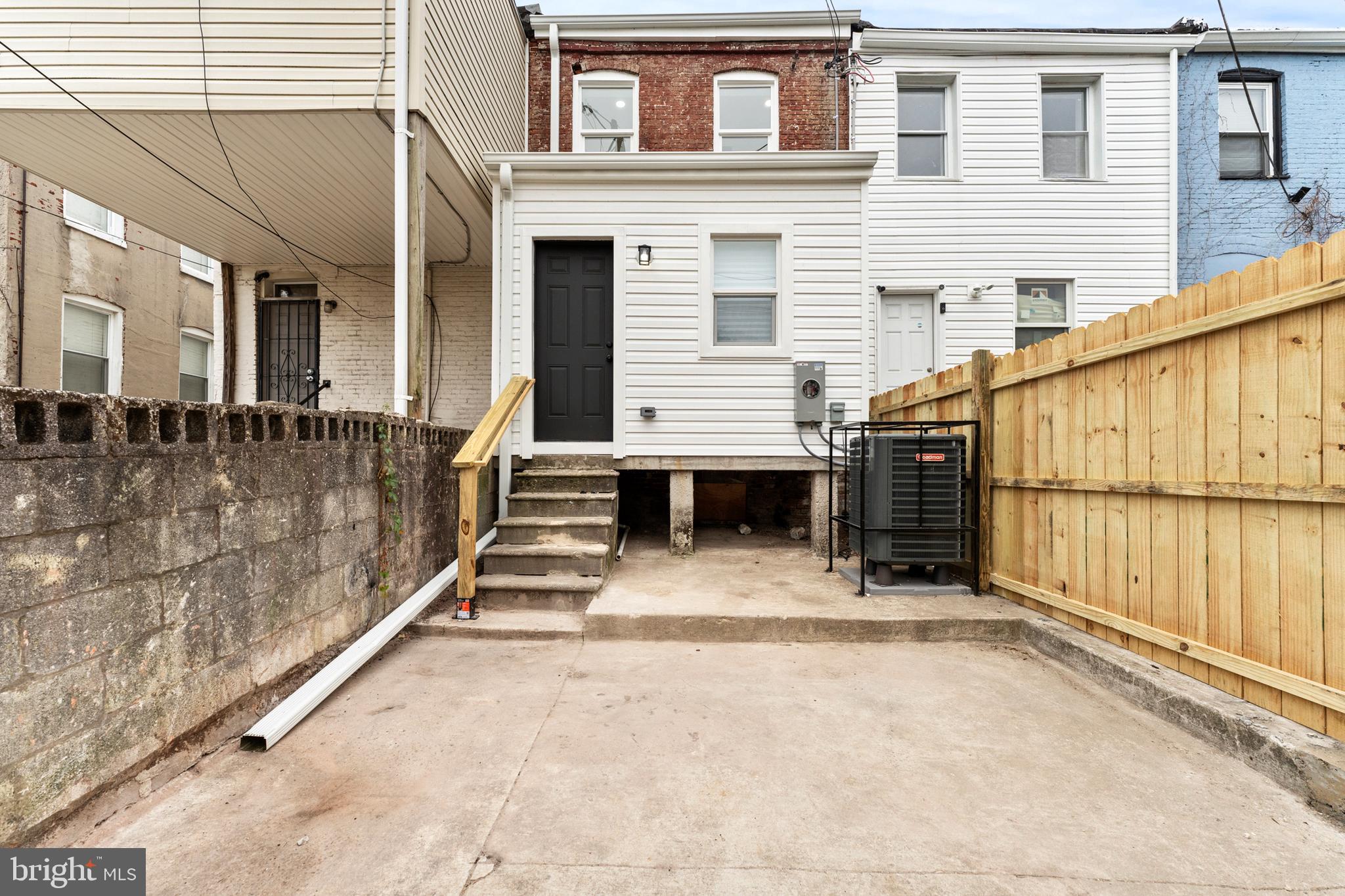1623 Rutland Avenue Baltimore, MD 21213 - Photo 33 of 38 a view of a house with a stairs and a yard