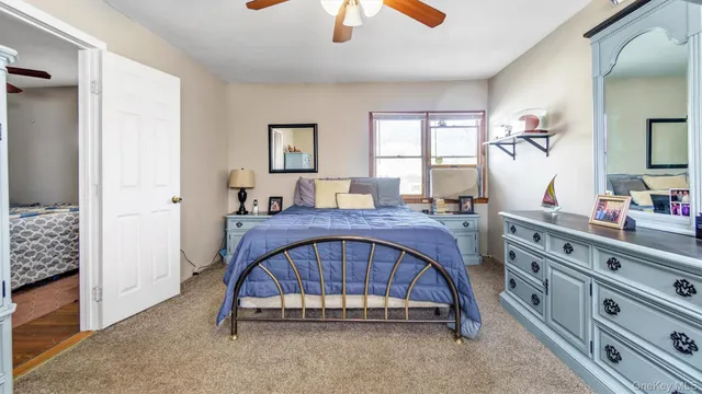 a bed room with a bed and a window