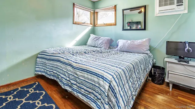 a bedroom with bed and a window