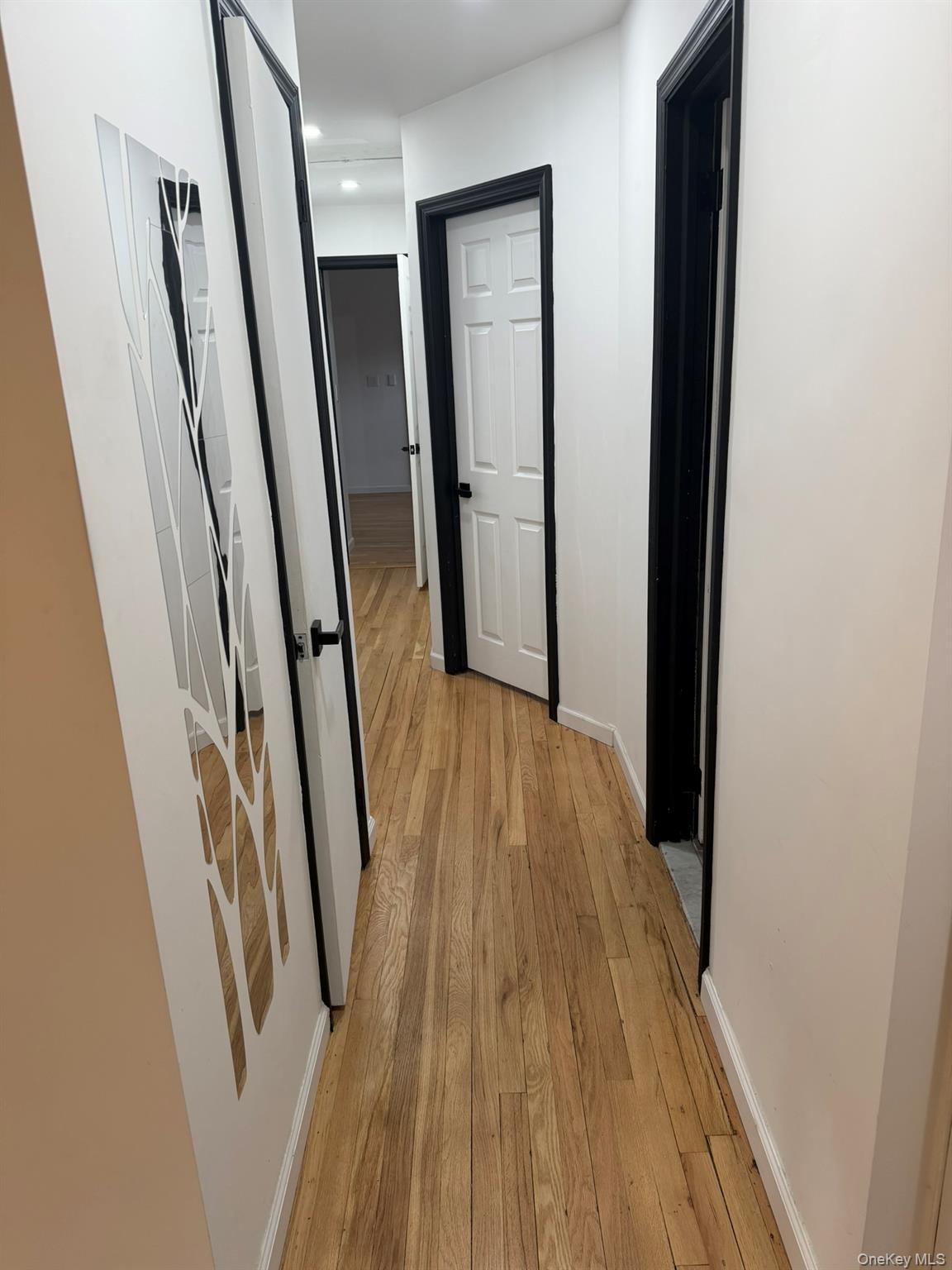19 7th Street Bayville, NY 11709 - Photo 5 of 15 a view of hallway with wooden floor
