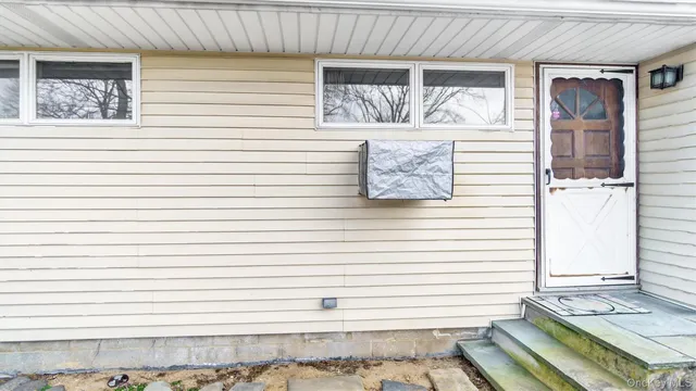 a view of a door and a window