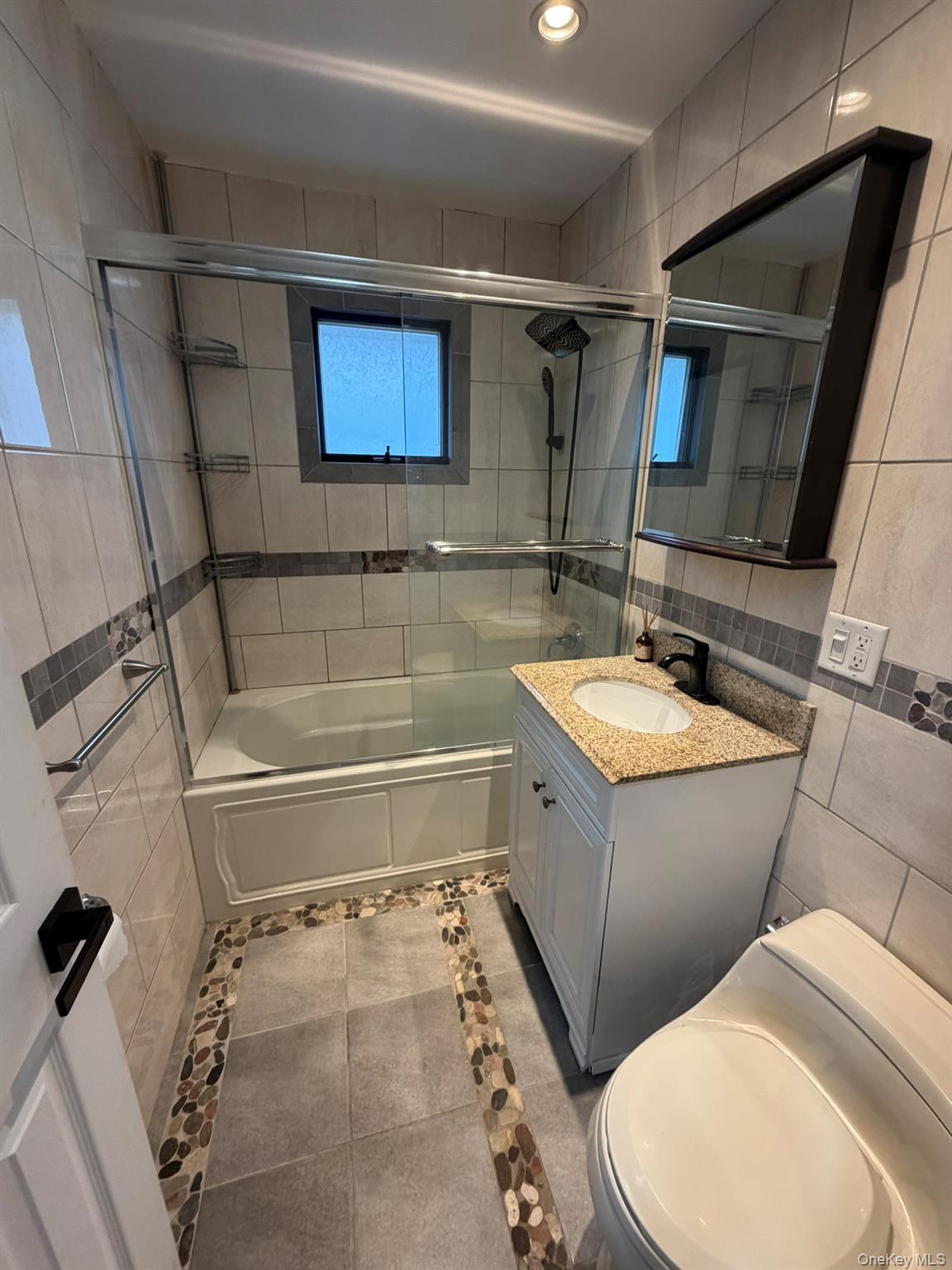 19 7th Street Bayville, NY 11709 - Photo 7 of 15 a bathroom with a sink toilet and shower