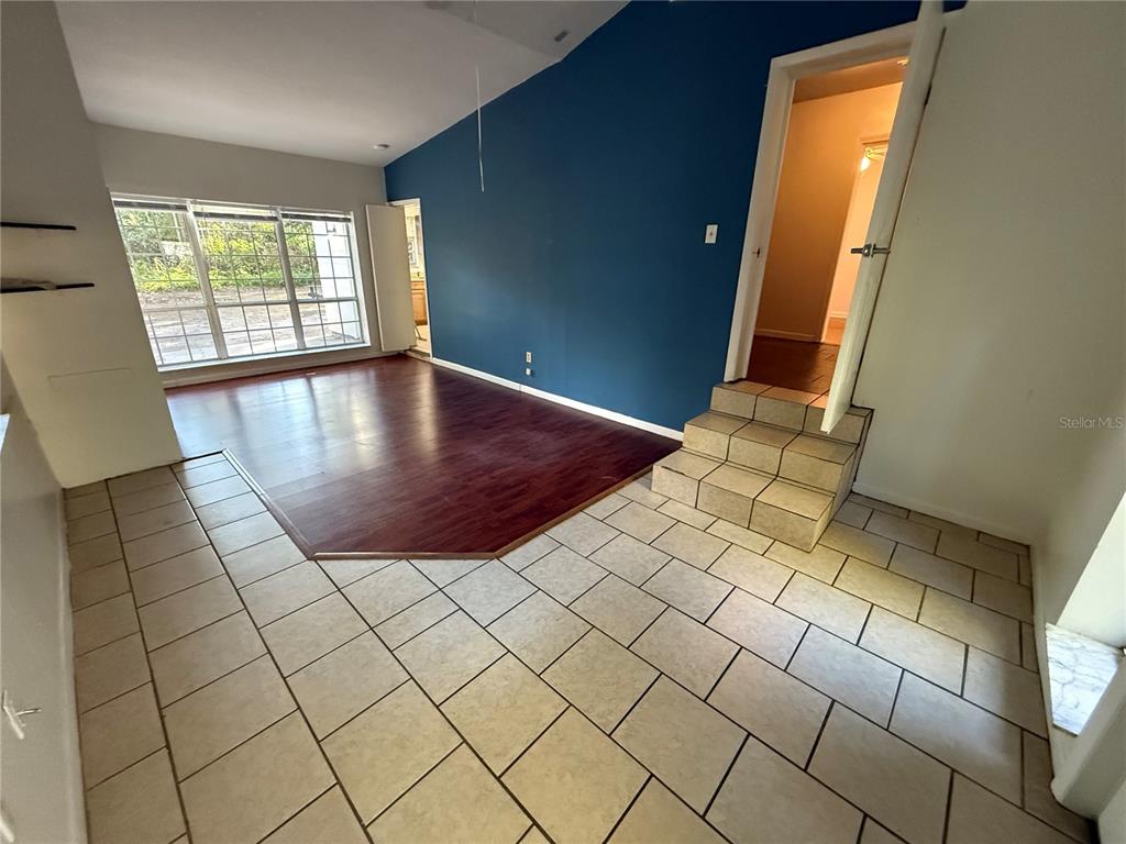 403 Northwest 25 Street Gainesville, FL 32607 - Photo 9 of 14 an empty room with windows