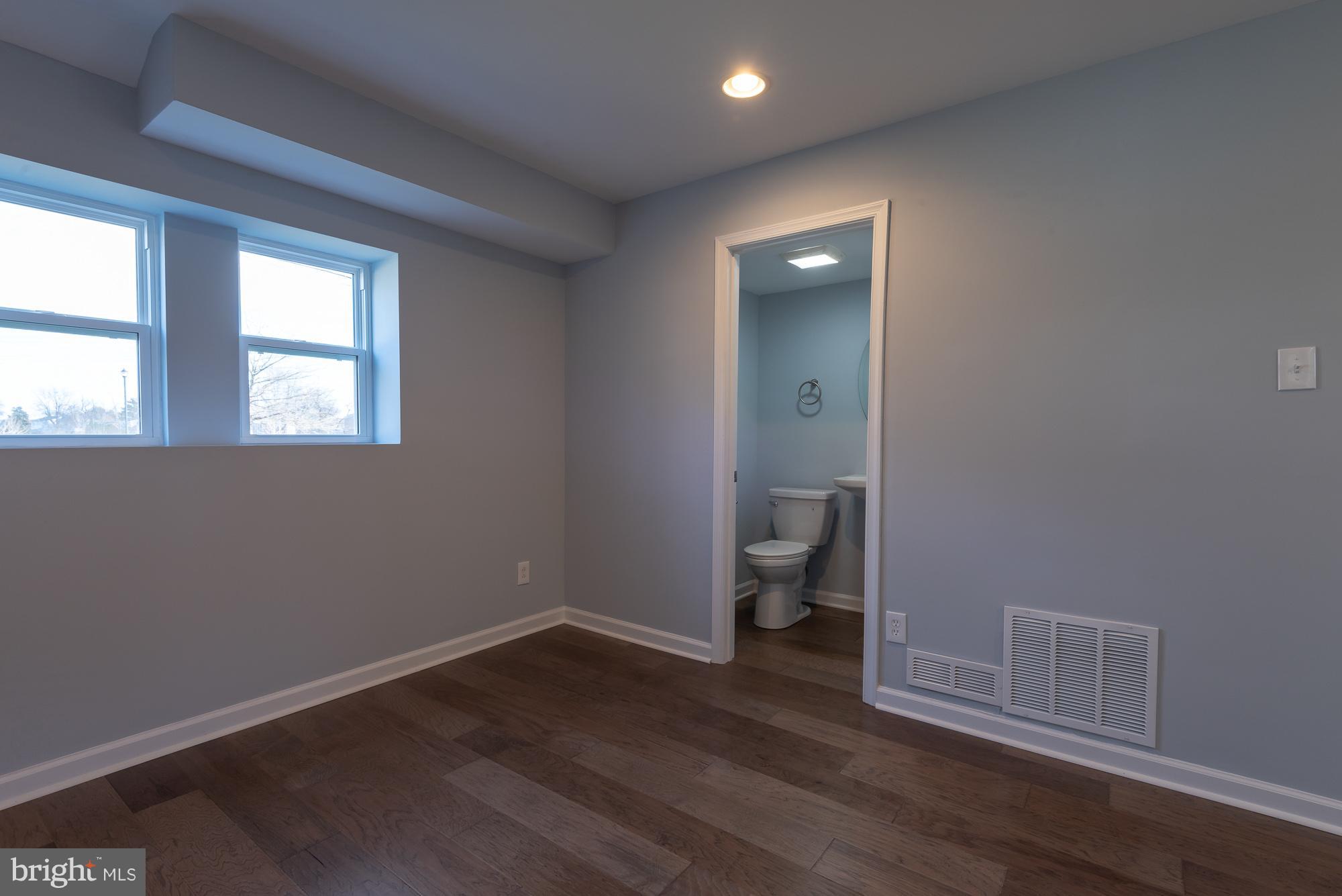 3609 Sollers Point Road Dundalk, MD 21222 - Photo 7 of 23 living room and powder room