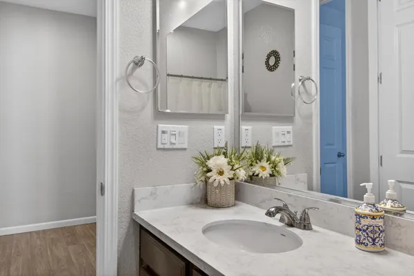 a bathroom with a sink and a mirror