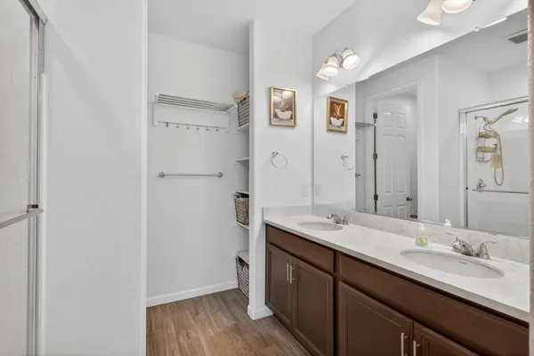 a bathroom with a granite countertop sink mirror and double