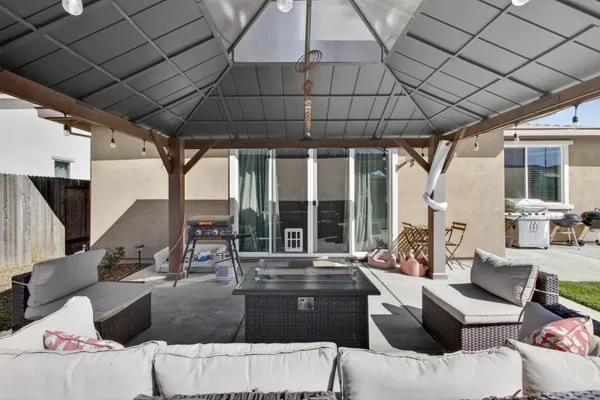 a living room with furniture and a large window