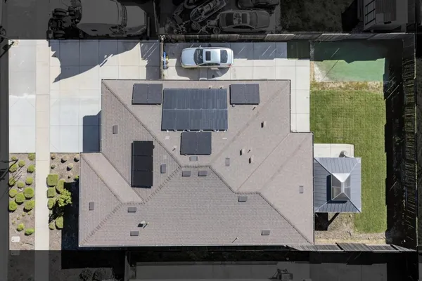 an aerial view of residential houses with outdoor space