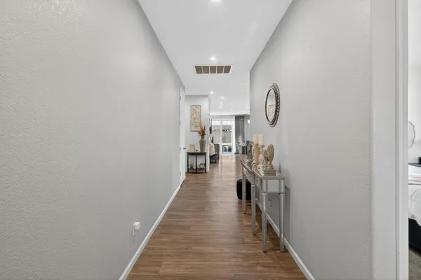 a hallway with wooden floor