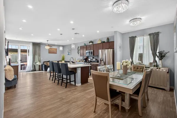a view of a dining room with furniture and wooden floor