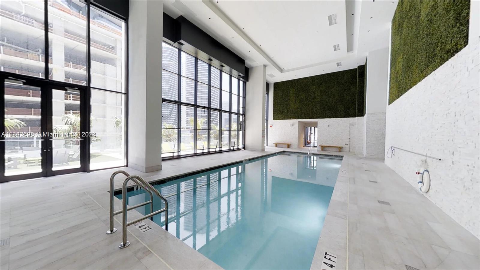 1010 Brickell Avenue, Unit 3209 Miami, FL 33131 - Photo 12 of 17 a view of a living room and balcony furniture