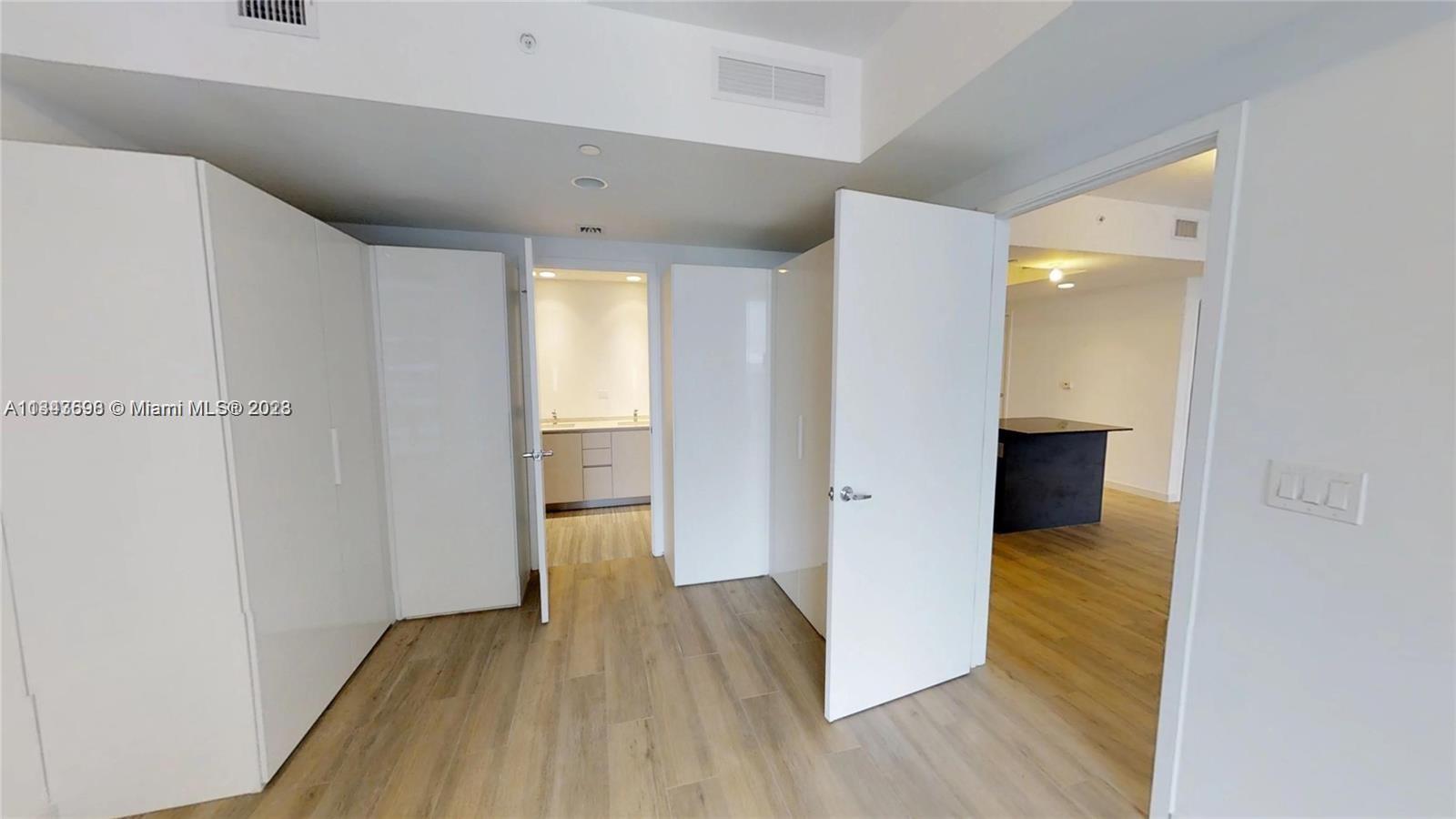 1010 Brickell Avenue, Unit 3209 Miami, FL 33131 - Photo 5 of 17 a view of a room with wooden floor and entryway