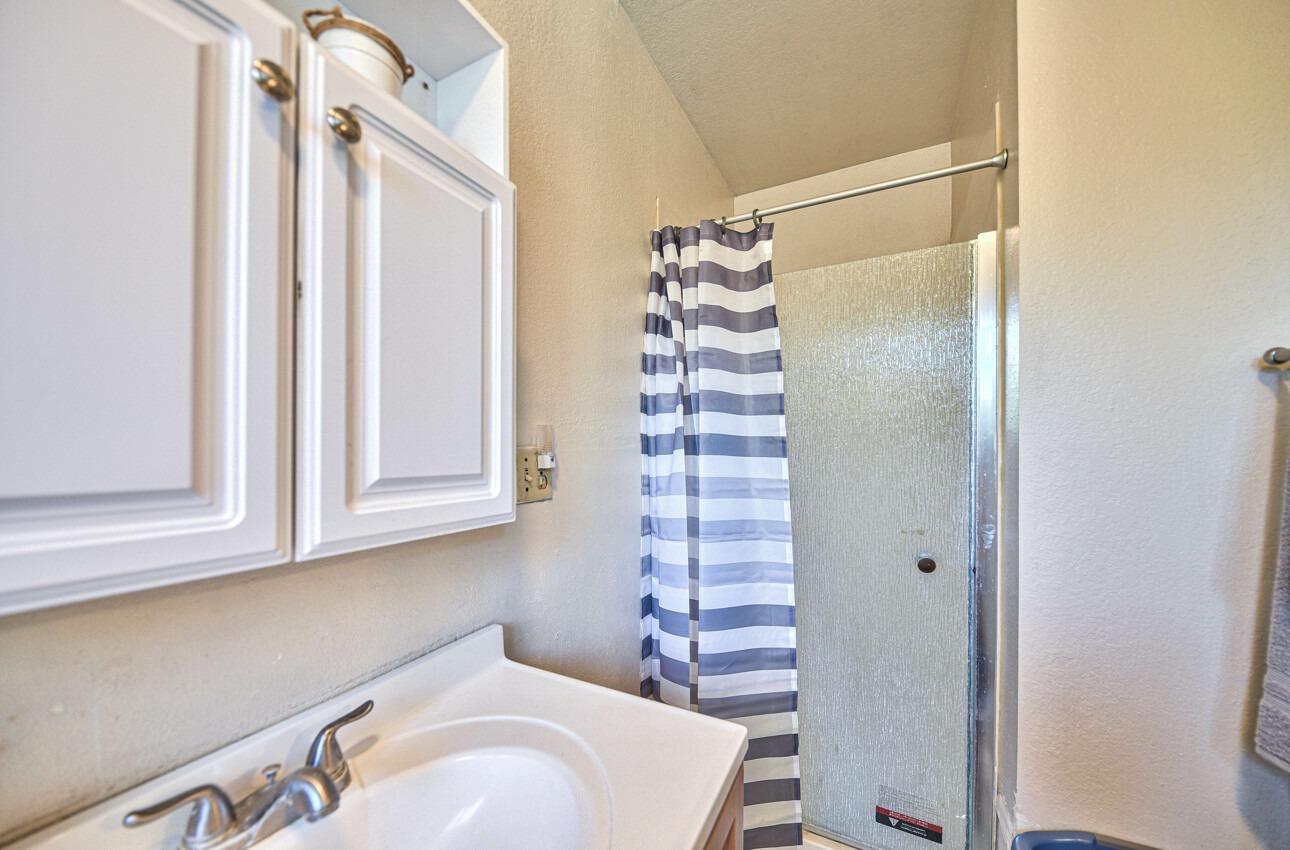 140 Inca Drive Soledad, CA 93960 - Photo 11 of 18 a bathroom with a sink and mirror