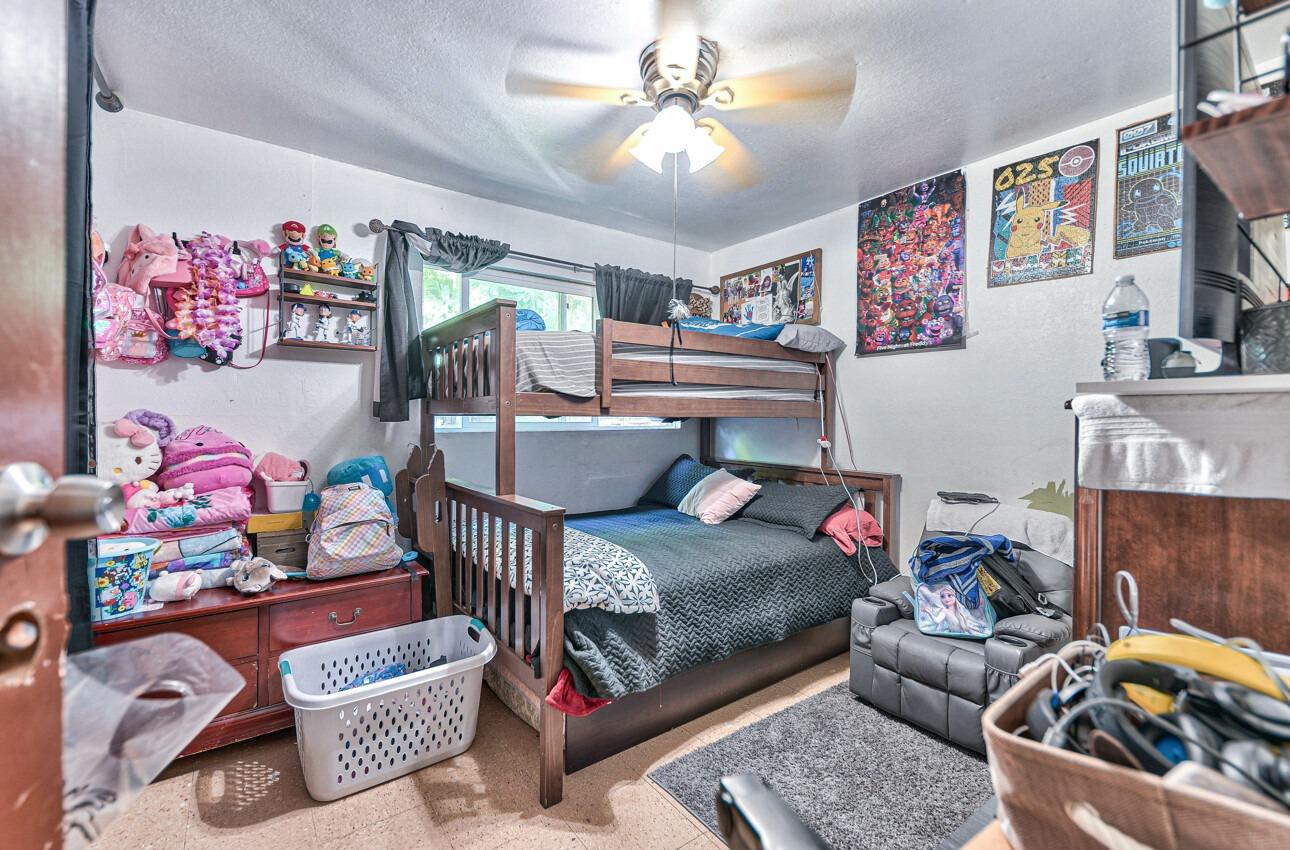 140 Inca Drive Soledad, CA 93960 - Photo 12 of 18 a bedroom with furniture and a chandelier