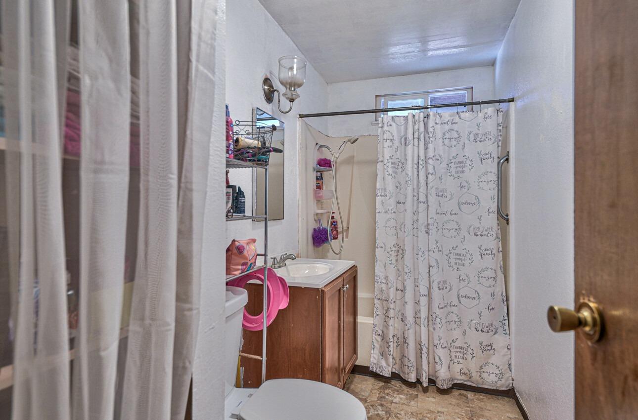 140 Inca Drive Soledad, CA 93960 - Photo 14 of 18 a bathroom with a sink toilet and shower