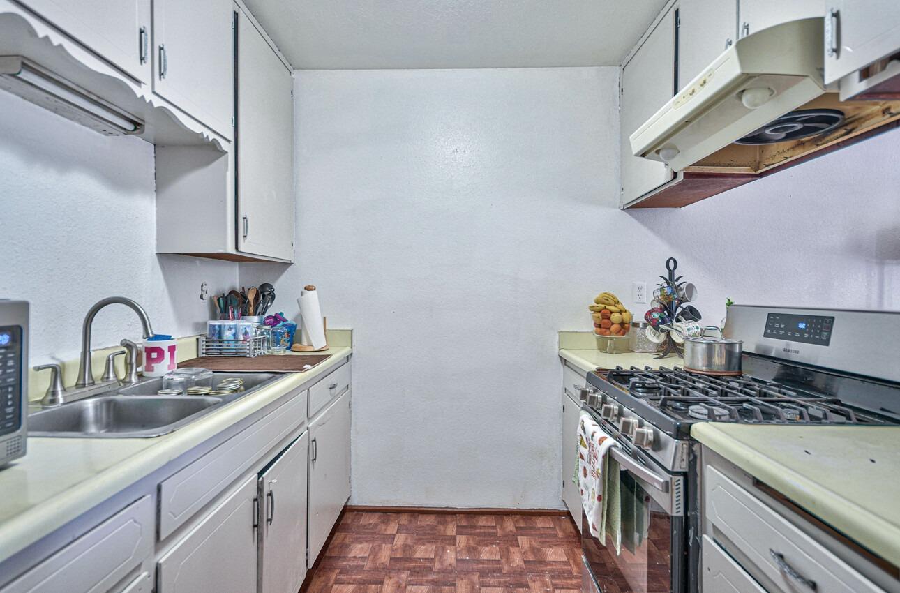 140 Inca Drive Soledad, CA 93960 - Photo 6 of 18 a kitchen with stainless steel appliances granite countertop a sink stove and cabinets