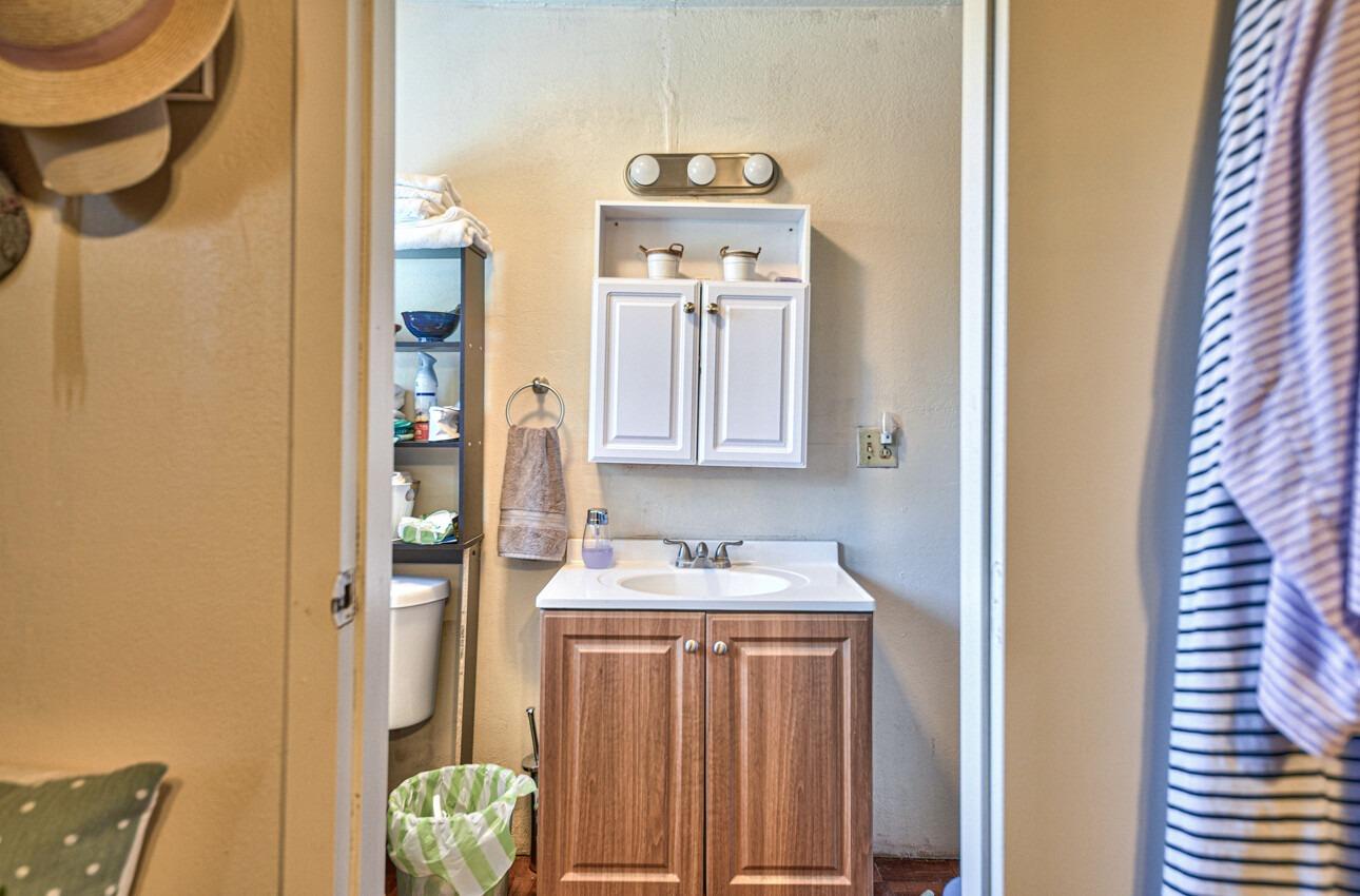 140 Inca Drive Soledad, CA 93960 - Photo 10 of 18 a bathroom with a sink a mirror and a shower