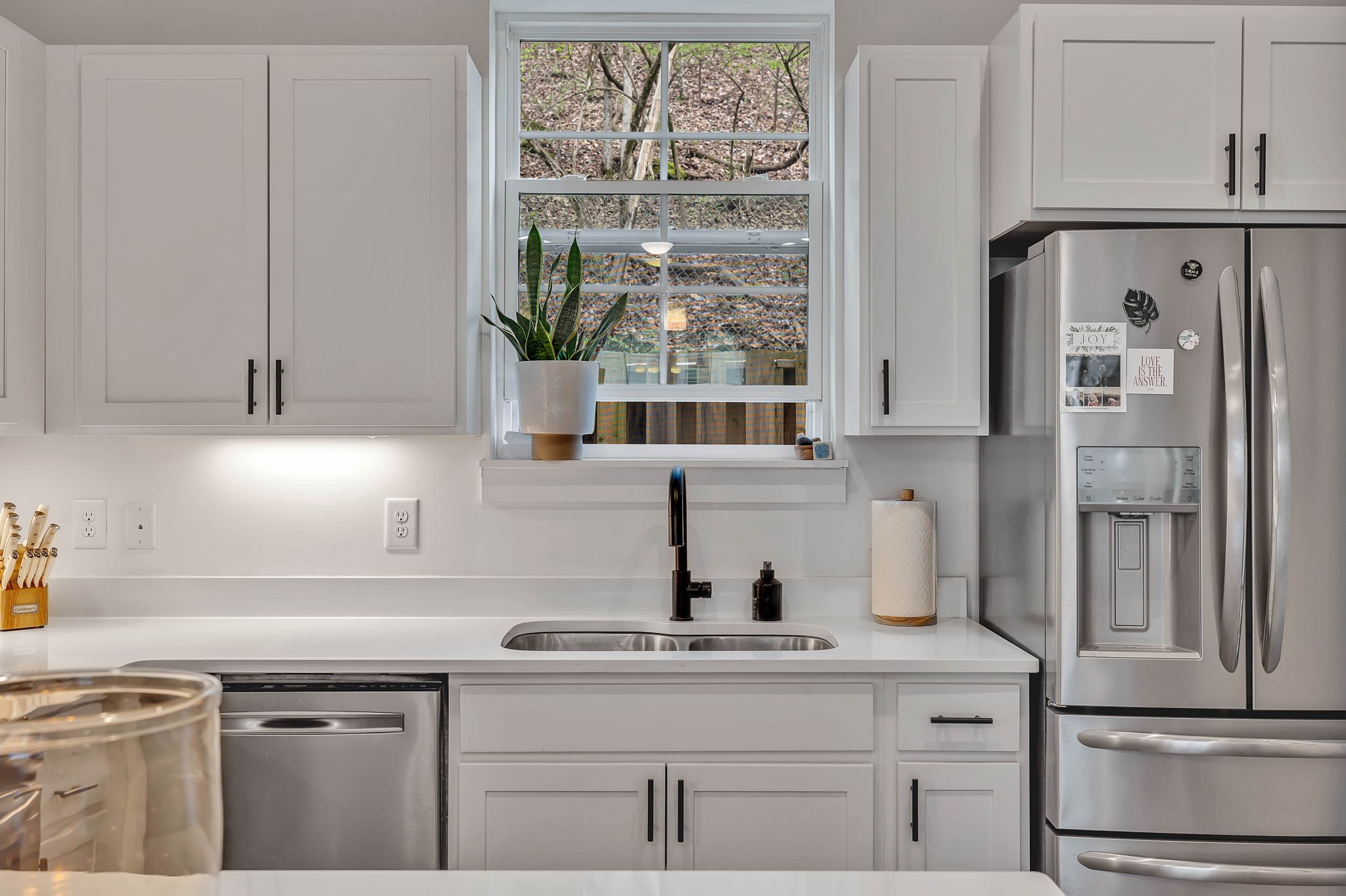 2024 Morrison Ridge Drive Nashville, TN 37221 - Photo 13 of 31 a kitchen with stainless steel appliances white cabinets and a window