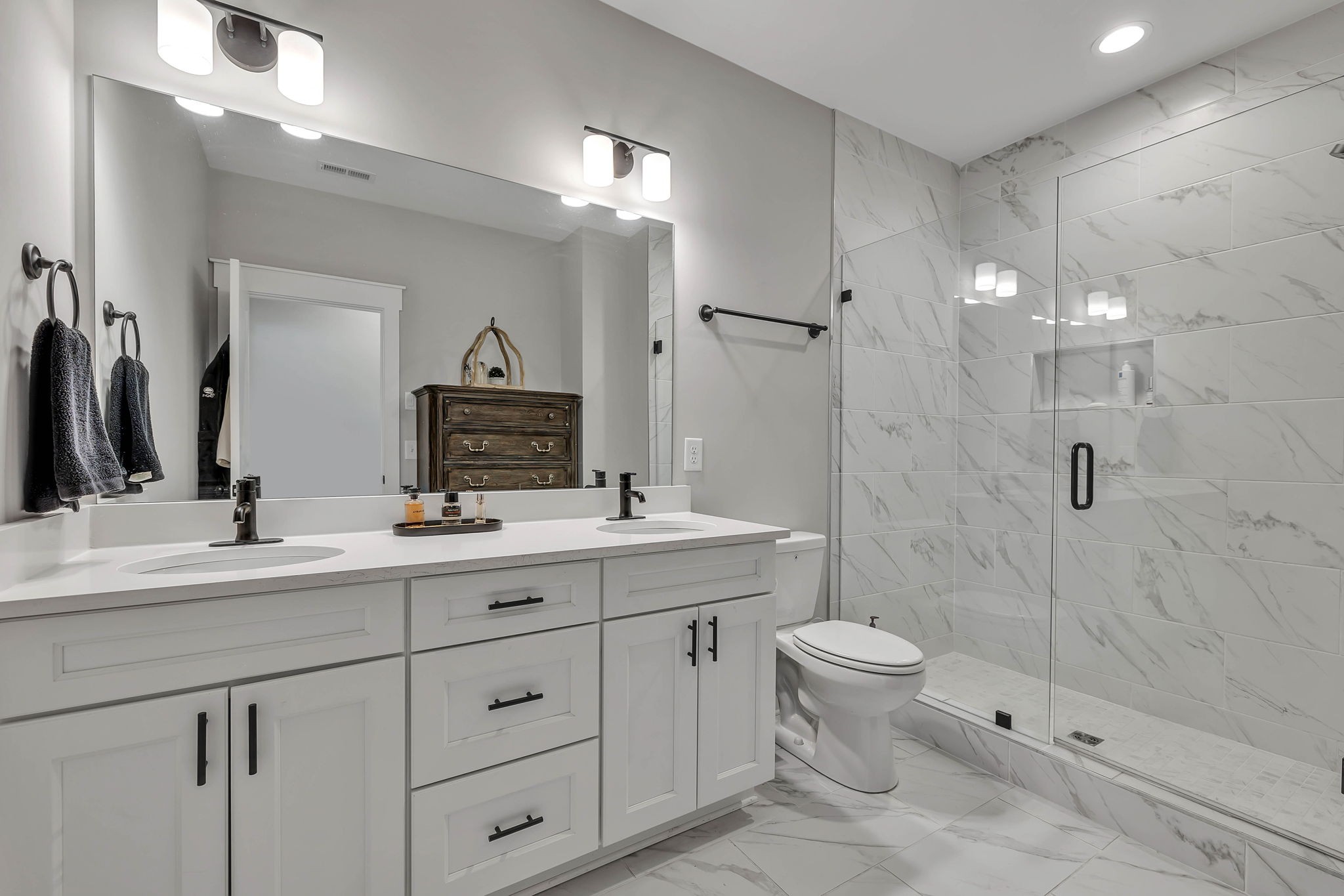 2024 Morrison Ridge Drive Nashville, TN 37221 - Photo 20 of 31 a bathroom with a double vanity sink toilet and shower