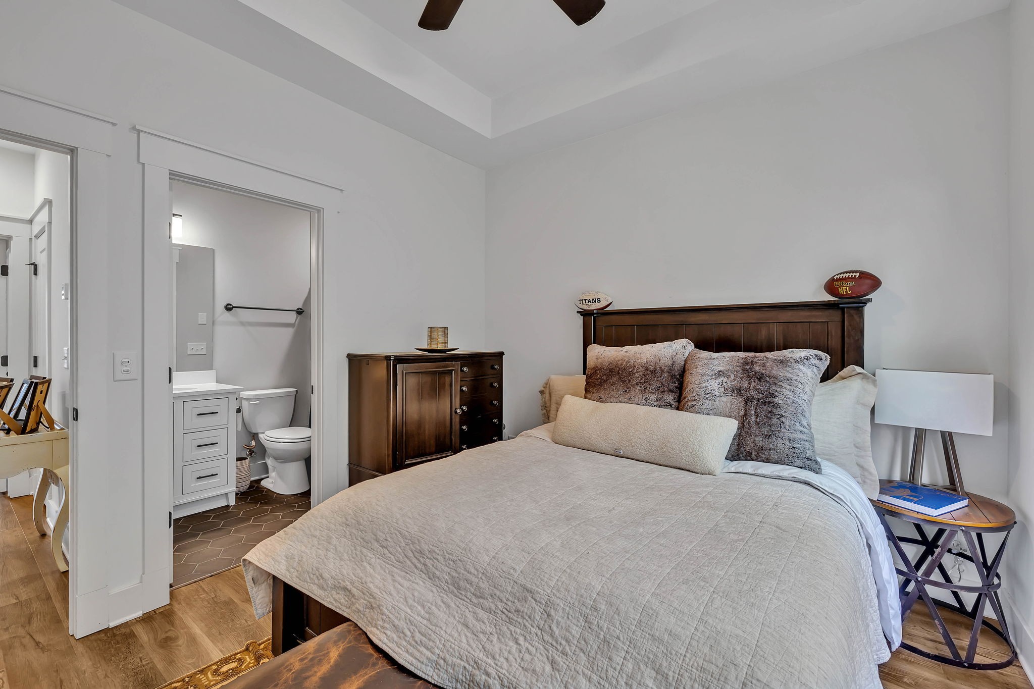 2024 Morrison Ridge Drive Nashville, TN 37221 - Photo 23 of 31 a bedroom with a bed and a chandelier