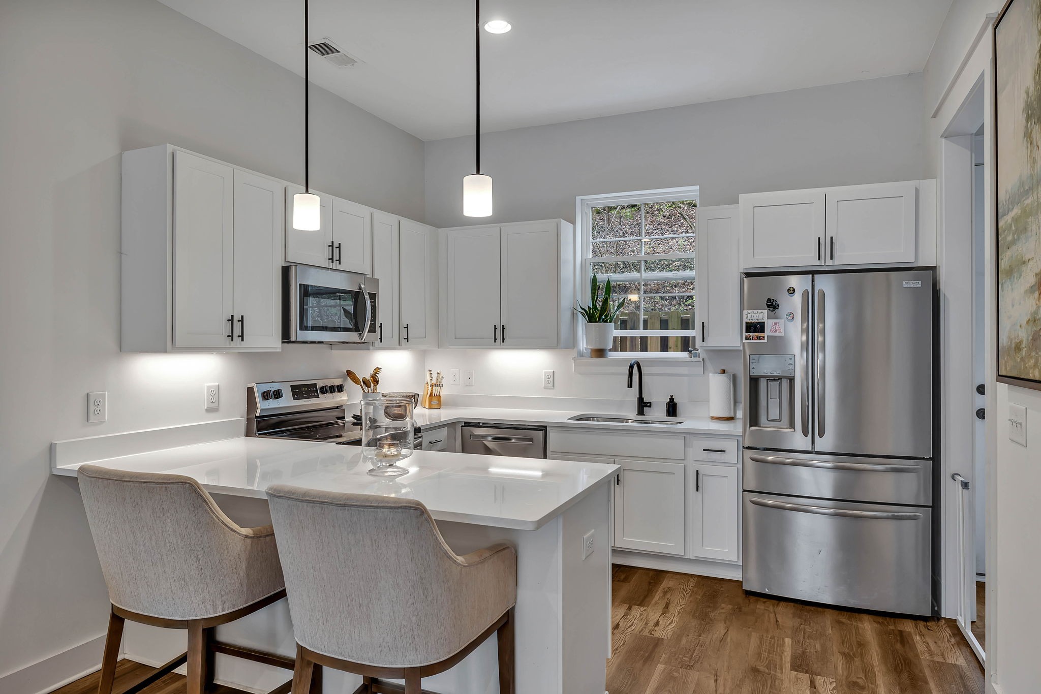 2024 Morrison Ridge Drive Nashville, TN 37221 - Photo 9 of 31 a kitchen with stainless steel appliances a sink a stove a refrigerator cabinets and chairs