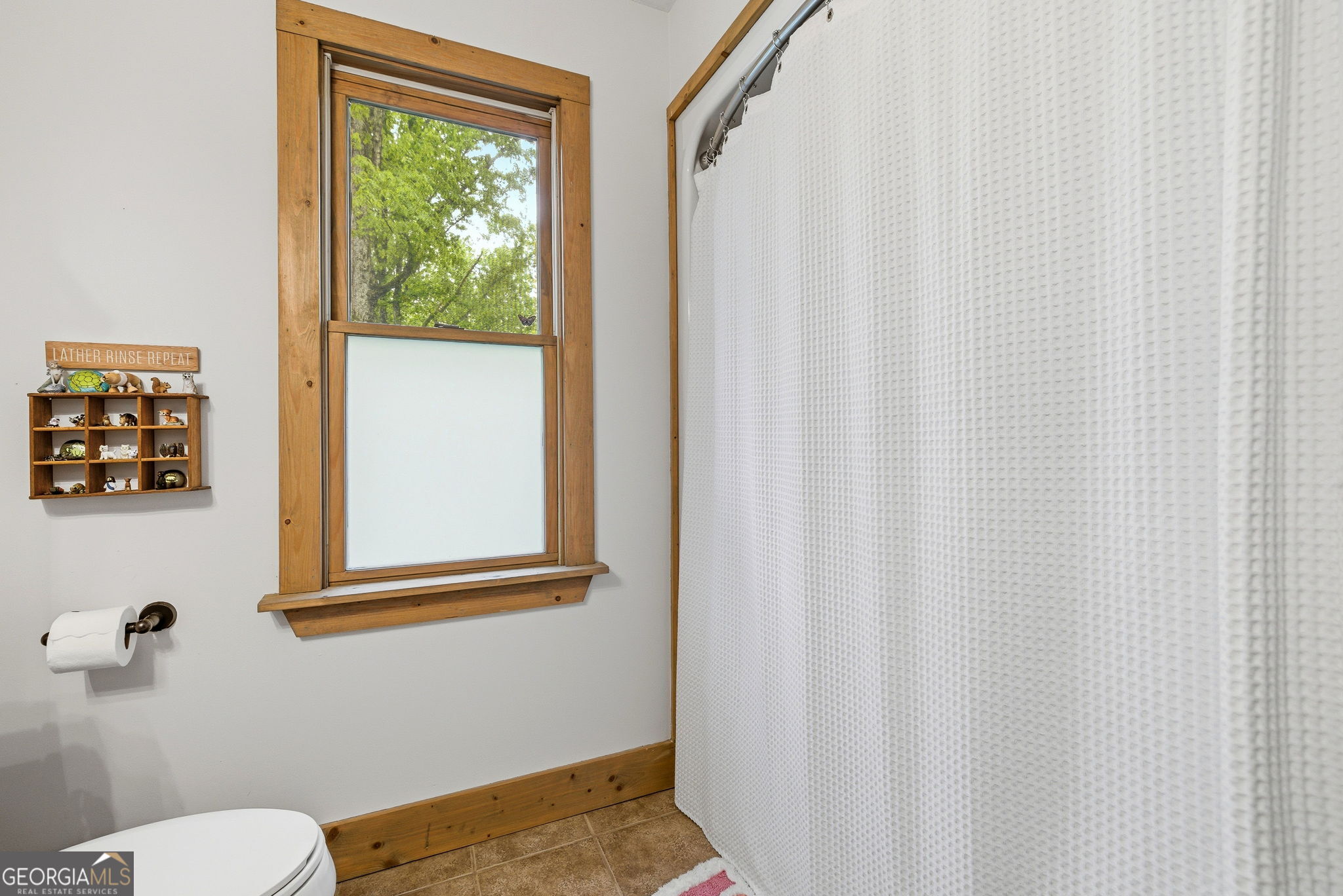 634 Little Hawk Road Sautee Nacoochee, GA 30571 - Photo 32 of 54 a bathroom with a toilet and a window