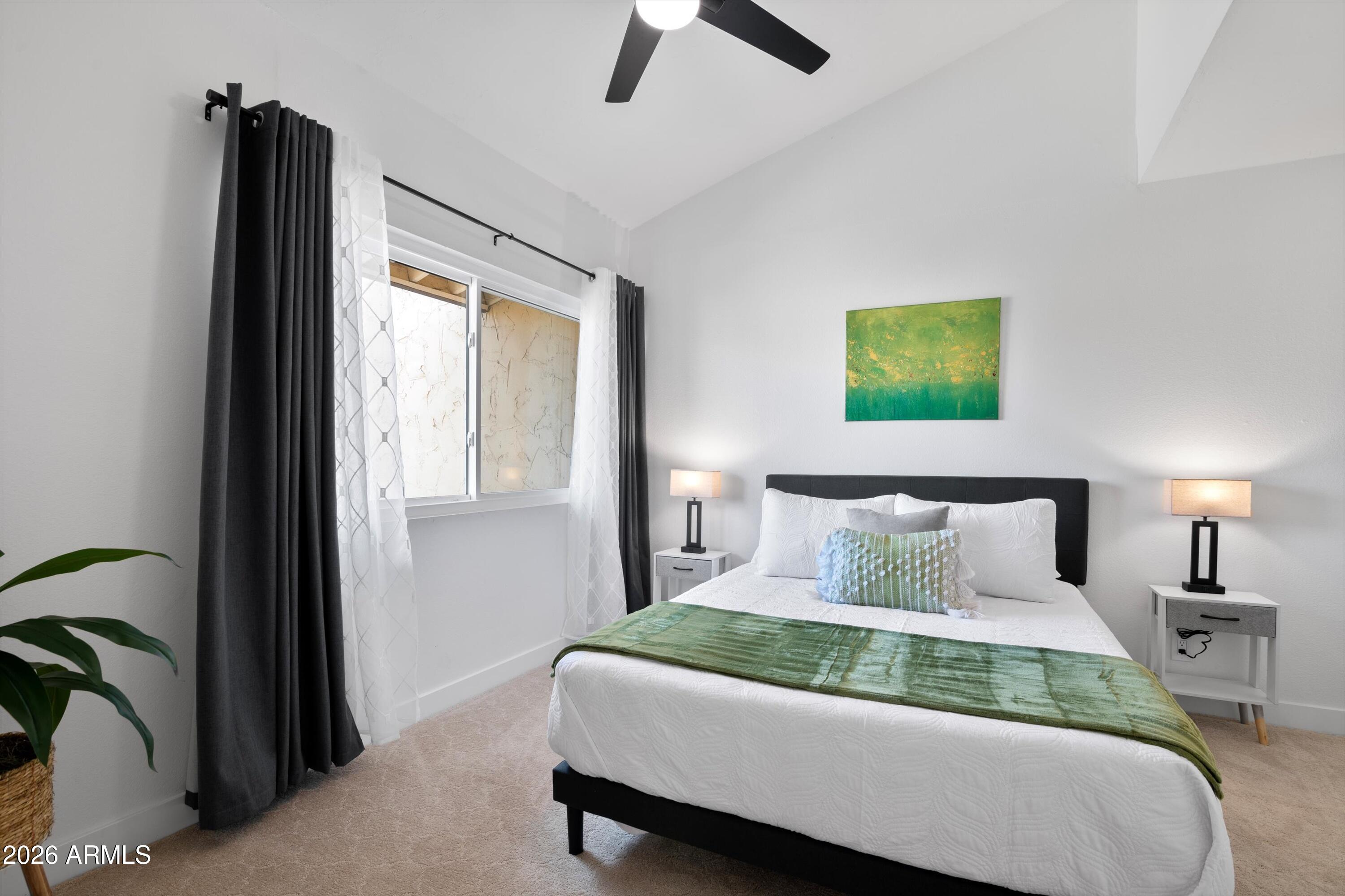 8055 East Thomas Road, Unit D105 Scottsdale, AZ 85251 - Photo 12 of 32 a bedroom with bed and a window