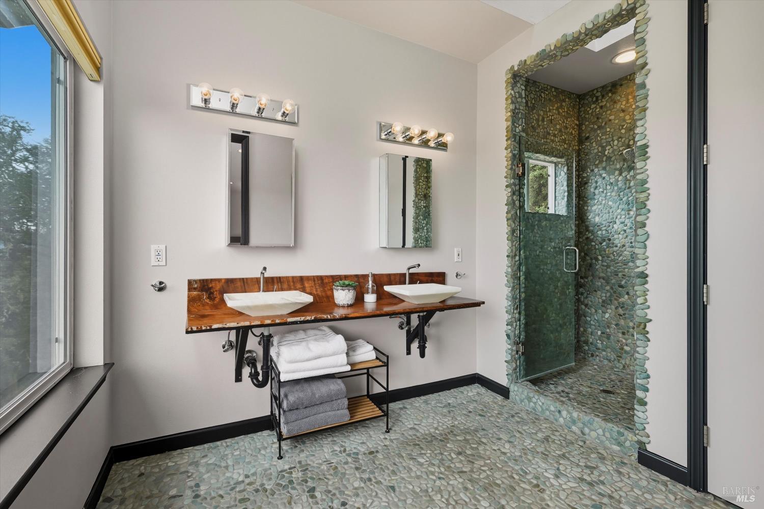 31000 Pine Mountain Road Cloverdale, CA 95425 - Photo 33 of 61 Spa-inspired bathroom with river rock walk-in shower and handcrafted wood vanity.
