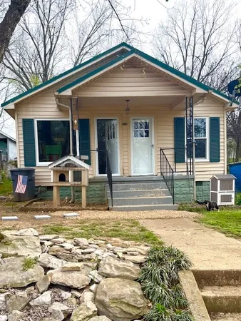 a view of a house with swimming pool and porch